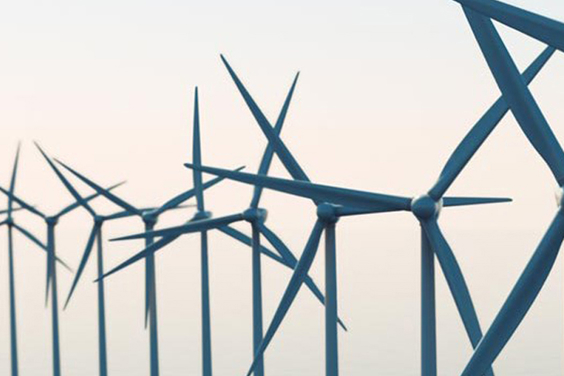Multiple wind turbine propellers in an offshore wind farm.