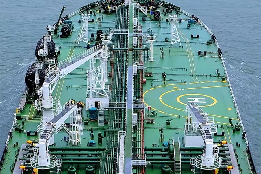Birds eye view of a green tanker at sea.